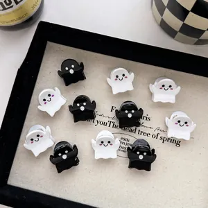 Cute black and white ghost hair clips on a tray for Halloween and daily hair styling