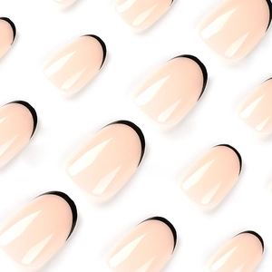 Short black French tip press-on nails with nude base and glossy finish on white background