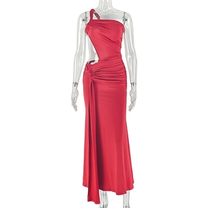 Detail of red one shoulder dress featuring waist cut-out and elegant side draping fabric