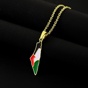 Close-up of golden Palestine map pendant with colorful oil drip enamel finish