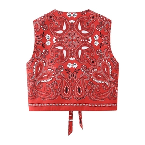 Detail of red paisley print cotton vest with adjustable lace-up back hem design