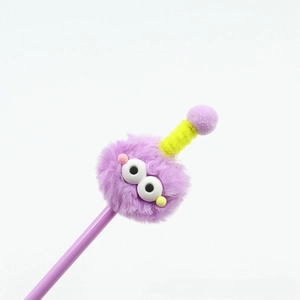 Detail of cute purple monster pen with plush pom pom and spiral antenna topper