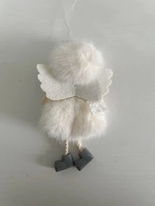 Detail of white plush angel ornament with gray boots for Christmas tree decoration
