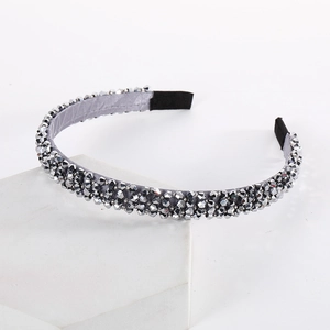 Detailed shot of sparkling silver-grey beaded headband with soft satin fabric and non-slip ends