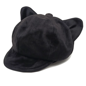 Detail of cute cat ear design on black suede beret cap with premium matte texture