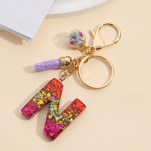 Colorful glitter resin letter N keychain with purple tassel and star ball charm