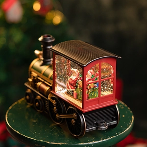 Vintage red Christmas Santa steam train snow globe with glitter and warm LED lights
