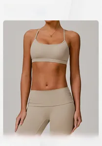 Detail of light beige yoga set with U-neck sports bra and high-waist leggings on model