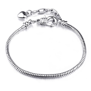 Silver snake chain bracelet with heart pendant and lobster clasp on white background