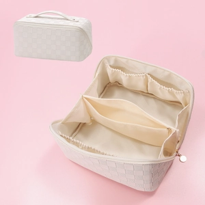 Detailed interior of checkered PU leather makeup bag showing compartments and handle