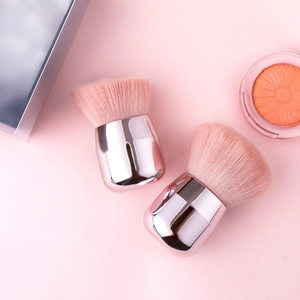 Mushroom head makeup brush set with rose gold handles and soft pink synthetic bristles