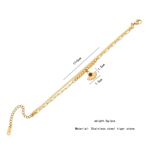 Detail view of gold stainless steel layered bracelet with tiger eye stone and dimensions