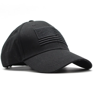 Close-up of black tactical baseball cap featuring embroidered American flag patch detail