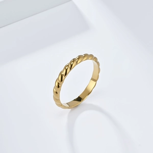 Macro shot of 18K gold plated twisted rope ring showing detailed metallic texture