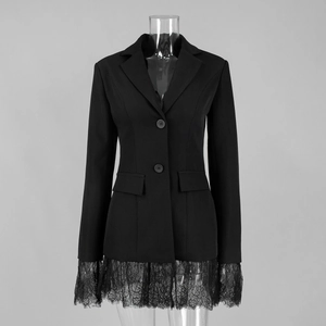 Detail of elegant black blazer featuring exquisite eyelash lace hem and flap pocket design
