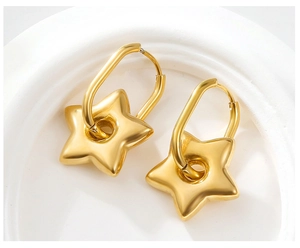 Detailed view of 18k gold plated stainless steel hoop earrings with 3D star pendants