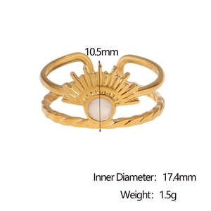 Detail of 18k gold plated ring with sunburst motif and white gemstone inlay