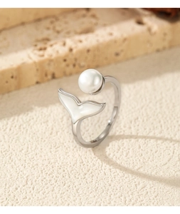 Macro shot of S925 silver mermaid tail ring with lustrous white pearl and shell inlay