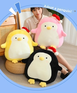 Detailed view of cute penguin plush toys with festive Christmas hats in various colors.