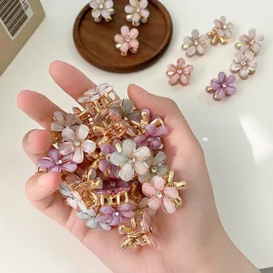 Chic floral mini hair clips with sparkling resin petals and golden metal base