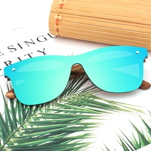Bamboo wood sunglasses with polarized green mirrored lenses and metal rivet details