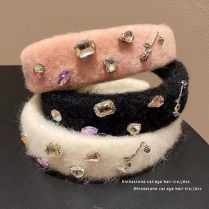 Plush faux mink headbands with rhinestones and metal charms in pink, black, and white