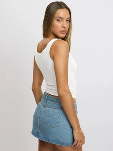 Slim fit white sleeveless tank top showing open back design and ribbed cotton texture