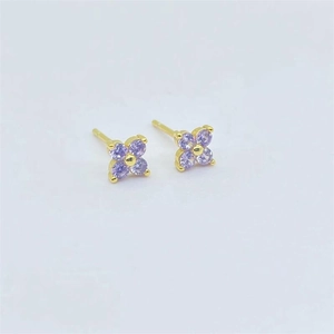Detail of S925 sterling silver four-leaf clover stud earrings with purple zirconia crystals