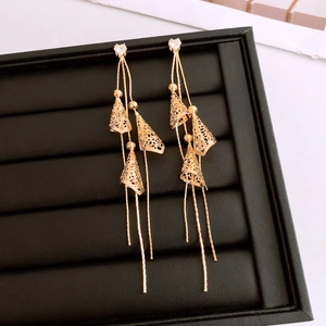 Detail of 18K gold plated heart earrings with long hollow cone tassel pendants