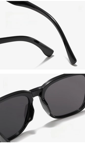Detail of curved temples and integrated nose pads on trendy black sunglasses