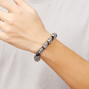 Vintage punk skull beaded bracelet for men featuring matte black beads and silver accents