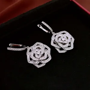 Exquisite silver-toned zircon hollow flower hoop earrings with pavé-set petal details