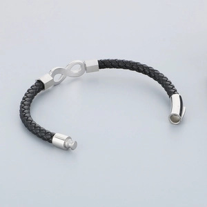Detail of infinity symbol charm and woven leather texture on men's magnetic bracelet
