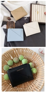 Detail view of multi-color PU leather coin purses with zip and Classic Star text