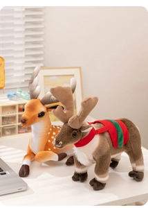 Detailed view of plush reindeer and spotted deer toys in a warm domestic setting