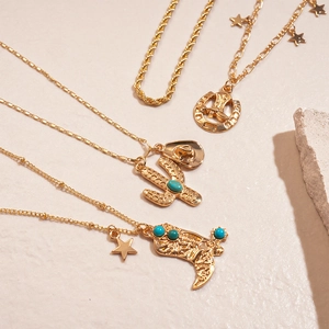 Gold layered western necklace set with cactus cowboy boot and turquoise charms