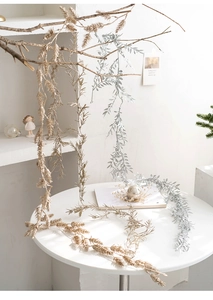 Detail of glittered gold and silver artificial vine leaves for Christmas decor