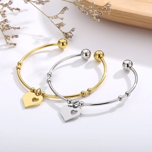 Elegant gold and silver stainless steel open bracelets with hollow heart pendants