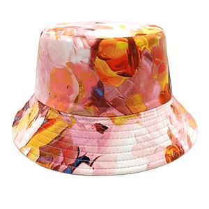Detailed view of bucket hat with vibrant pink and orange floral art pattern printing