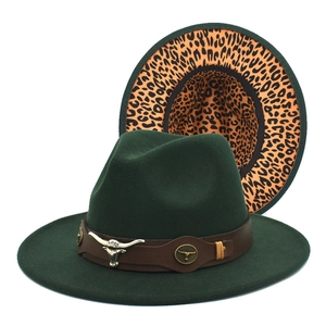 Detail of dark green wool fedora with bull head metal accent and leopard print brim bottom