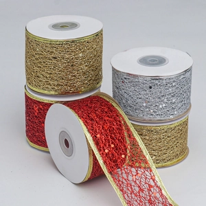 Detail showing red, gold, and silver sparkling sequin mesh ribbons on white spools