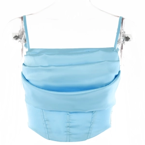 Detail view of light blue satin cowl neck top with corset boning structure
