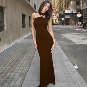 Close-up of halter neck dress with gold hardware buckle and deep brown slim fit fabric
