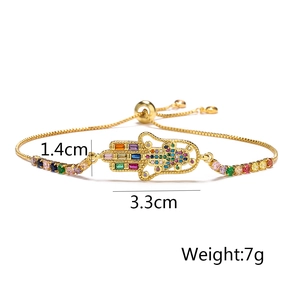 Detailed view of Hamsa Hand bracelet with multi-colored zircons, size 1.4cm x 3.3cm