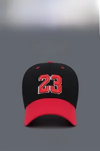 Close-up of number 23 embroidery on a black and red contrast baseball cap
