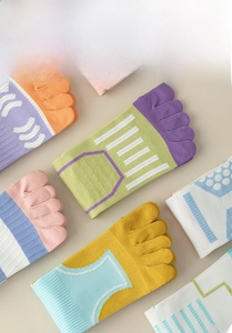 Detail view of colorful knit five-finger socks with reinforced toe separation design