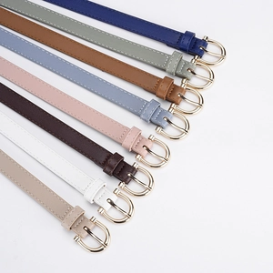 Slim women's PU leather belts in 8 colors with golden horseshoe buckles on white background
