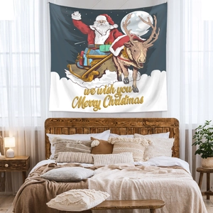 Detail of Christmas tapestry showing Santa on reindeer sleigh above a bed in bedroom