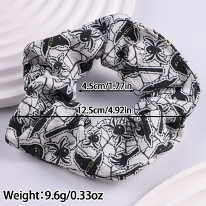 Large Halloween scrunchie with black spider web pattern and size specification