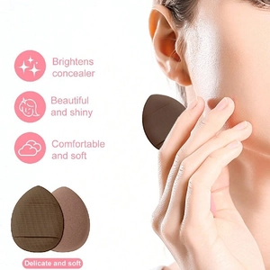 Detail of soft drop-shaped makeup sponge showing finger strap for easy concealer blending